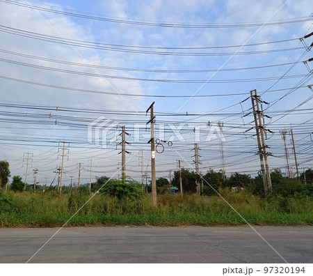 View of poles and power lines in Thailand View of poles and power lines in Thailand 97320194