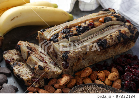 Close up homemade Banana cake with chocolate chip made by almonds flour, put the cranberry and perilla seed no sugar for low carbohydrate diet. Healthy foods or Low-Carb Diet concept. Close up homemade Banana cake with chocolate chip made by almonds flour, put the cranberry and perilla seed no sugar for low carbohydrate diet. Healthy foods or Low-Carb Diet concept. 97322134