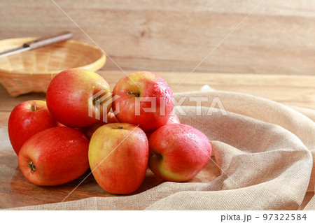 Closeup group of fresh Jazz Apples on wooden board background, Fruits concept. 97322584