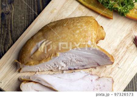 Smoke-smoked chicken on a board Smoke-smoked chicken on a board 97326573