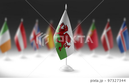 The national flag of the Wales on the background of flags of other countries 97327344