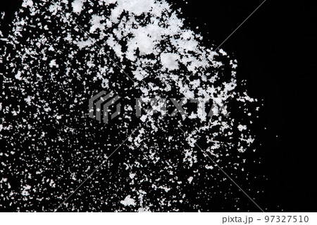 Photo image of falling down snow, heavy big small size snows. Freeze shot on black background isolated overlay. Fluffy White snowflakes splash cloud in mid air. Real Snow high speed shutter 97327510