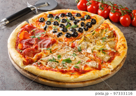 Pizza Four Seasons arranged into four sections, each representing a different season closeup on the board. Horizontal 97333116