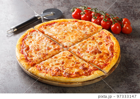 Homemade Greasy New York Cheese Pizza Ready to Eat closeup on the board. Horizontal 97333147