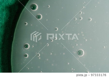 A drop of shampoo on a green background A drop of shampoo on a green background 97333176