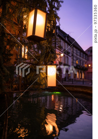 Lanterns on a fountain in Ribeauville Alsace Lanterns on a fountain in Ribeauville Alsace 97335360