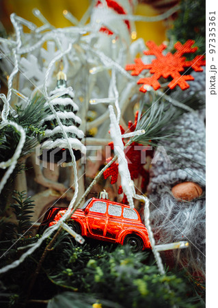 Red car, snowflake and Christmas tree on pine braches Red car, snowflake and Christmas tree on pine braches 97335361