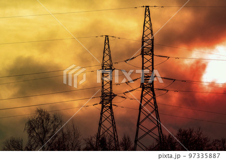 Electric power transmission lines in a dark smoke and fire light. Electric power transmission lines in a dark smoke and fire light. 97335887