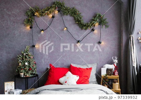 Stylish cozy Christmas bedroom with a large bed and decor 97339932