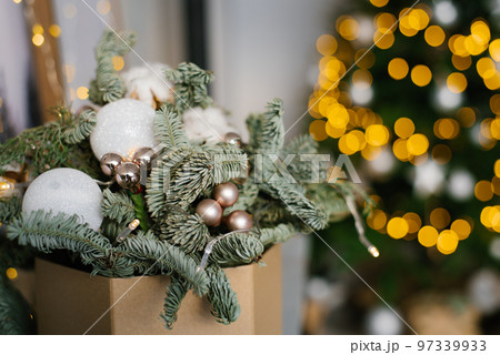 Christmas composition of fir branches, Christmas balls and cotton bolls. Selective focus. Copy space. 97339933