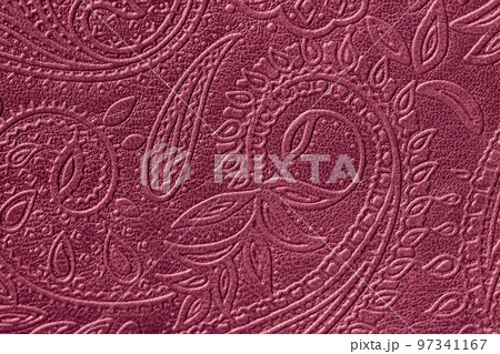 Texture of genuine leather close-up embossed floral pattern. Trending Viva Magenta color. Abstract background Texture of genuine leather close-up embossed floral pattern. Trending Viva Magenta color. Abstract background 97341167