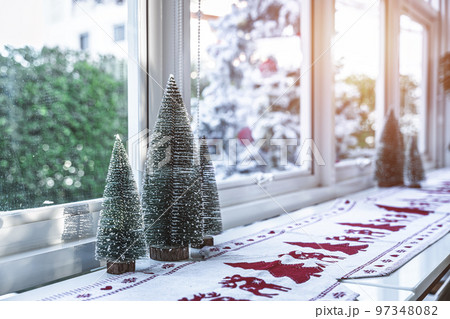 Close-up of Xmas decors and Xmas tree baubles on wood desk Celebrating Merry Christmas and New year. 97348082