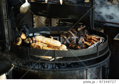 Grill outdoor with meat and bread in winter season 97349727