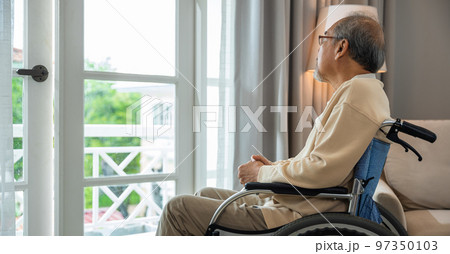 Lonely older thoughtful sad old man look outside windows in bedroom at retirement home, Asian senior man disabled feel depressed lonely sitting alone in wheelchair looking through window at hospital Lonely older thoughtful sad old man look outside windows in bedroom at retirement home, Asian senior man disabled feel depressed lonely sitting alone in wheelchair looking through window at hospital 97350103