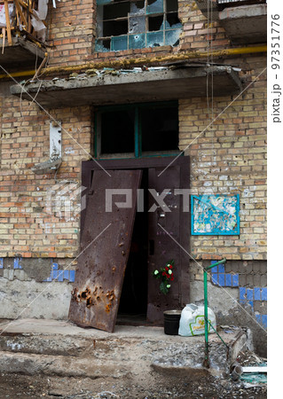 Building damaged by Russian bombardments. Building damaged by Russian bombardments. 97351776
