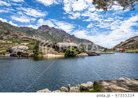 beautiful landscape of the coast of Ezaro Galicia in Spain, granite mountain, small town and beautiful beach 97355214
