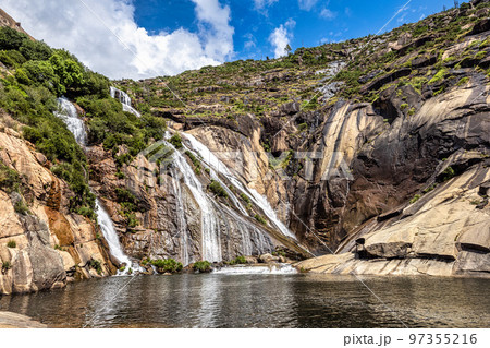 Ezaro waterfall, Galicia, Northern Spain in Spring. It empties into the Atlantic ocean in a waterfall 97355216