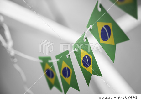 A garland of Brazil national flags on an abstract blurred background 97367441