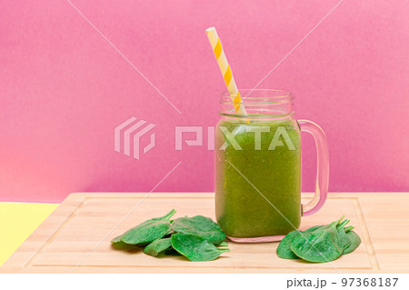 Fresh Green Smoothie of Apple, Celery, and Spinach in Glass Smoothie Jar 97368187