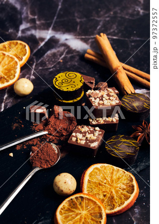 a variety of chocolates on a dark background a variety of chocolates on a dark background 97372557