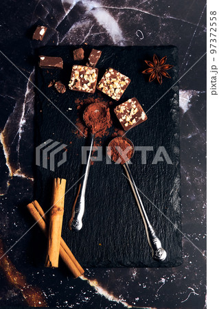 a variety of chocolates on a dark background a variety of chocolates on a dark background 97372558