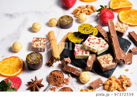 a variety of chocolates on a light background a variety of chocolates on a light background 97372559