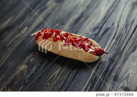 hot dog with vegetables on wooden background.photo with copy space 97372666
