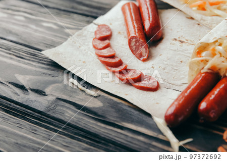 sliced sausage on pita bread .photo with copy space 97372692
