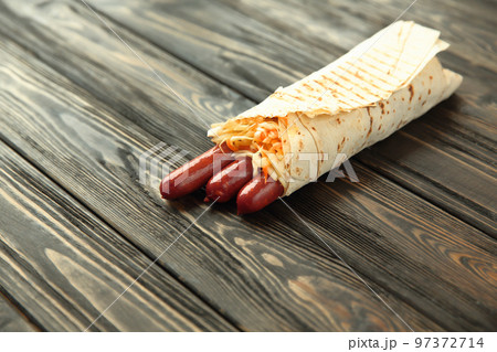 homemade sausages in pita bread on wooden background.photo with copy space 97372714