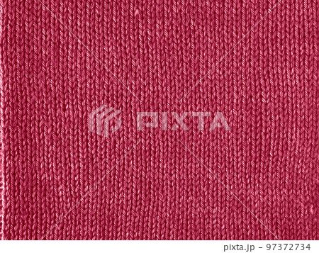 Knitted Viva Magenta texture jersey as background for color of Year 2023  97372734