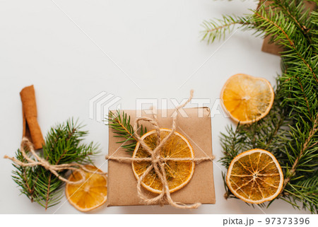 Eco friendly alternative green Xmas gifts wrapped with recycled craft paper. Zero waste Christmas, flat lay, top view Eco friendly alternative green Xmas gifts wrapped with recycled craft paper. Zero waste Christmas, flat lay, top view 97373396