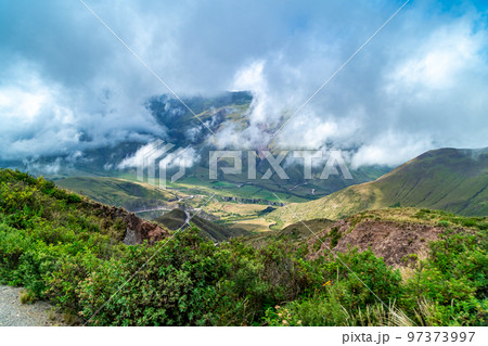 winding mountain roads in the Andes Mountains with a sky overcast with clouds. winding mountain roads in the Andes Mountains with a sky overcast with clouds. 97373997