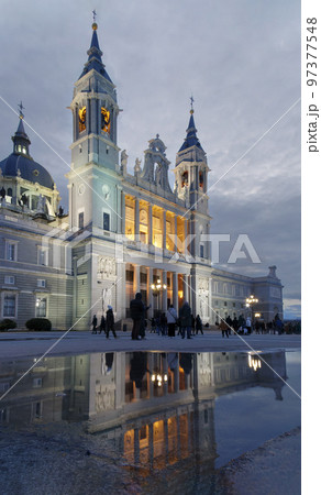 Puddle in which the doorway of the Cathedral is reflected 97377548
