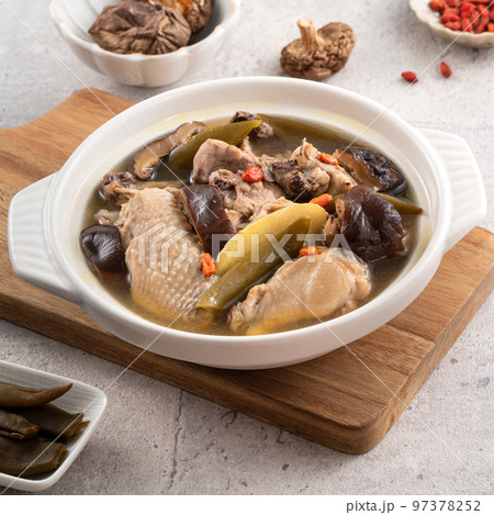 Delicious Taiwanese peeled green chili pepper chicken soup with mushroom and goji berry 97378252