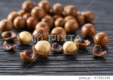macadamia on a black kitchen table, selective focus. macadamia on a black kitchen table, selective focus. 97381346