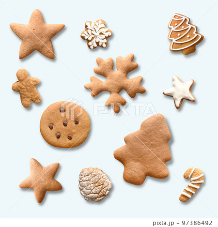 Pattern of Christmas homemade gingerbread cookies as snowflakes, stars, christmas tree on white background. Xmas abstract background. 97386492