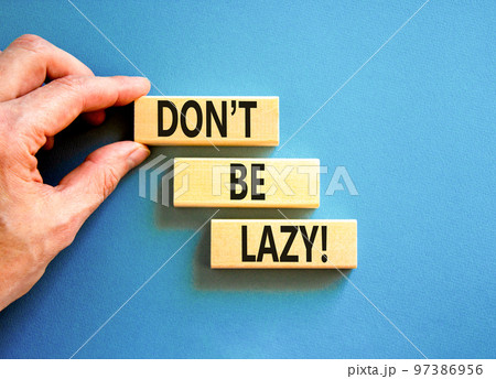 Motivational and do not be lazy symbol. Concept words Do not be lazy on wooden blocks on a beautiful blue table blue background. Businessman hand. Business do not be lazy concept. Copy space. Motivational and do not be lazy symbol. Concept words Do not be lazy on wooden blocks on a beautiful blue table blue background. Businessman hand. Business do not be lazy concept. Copy space. 97386956