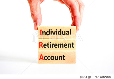 IRA individual retirement account symbol. Concept words IRA individual retirement account on wooden blocks on beautiful white background. Business IRA individual retirement account concept. Copy space IRA individual retirement account symbol. Concept words IRA individual retirement account on wooden blocks on beautiful white background. Business IRA individual retirement account concept. Copy space 97386960