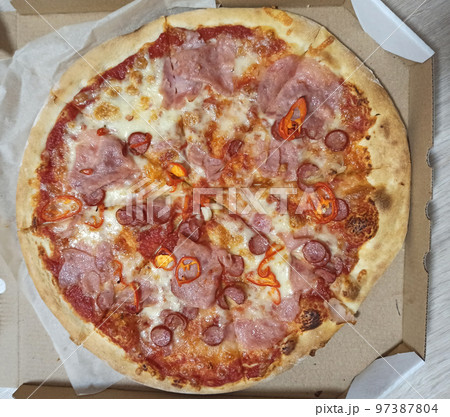 Slices of fresh appetizing pizza in box. Piza ready for eating. Fastfood Slices of fresh appetizing pizza in box. Piza ready for eating. Fastfood 97387804