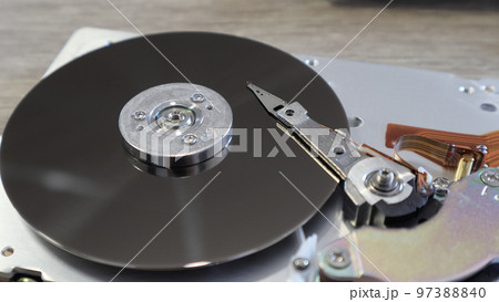 Disassembled computer hard drive. Data hard drive backup disc hdd disk restoration. Disassembled hard drive from the computer, hdd with mirror effect. 97388840