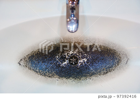 dirty sink after cleaning the clog in the pipe. dirty sink after cleaning the clog in the pipe. 97392416