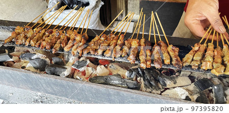 very flavorful beef satay meat grilled over charcoal, beef skewer delicious barbeque, sate sapi 97395820