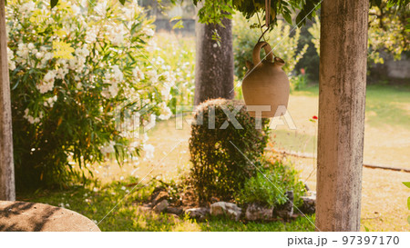 botijo in the sun on a white background botijo in the sun on a white background 97397170