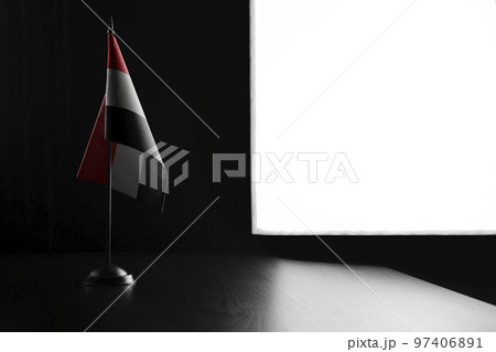 Small national flag of the Yemen on a black background Small national flag of the Yemen on a black background 97406891