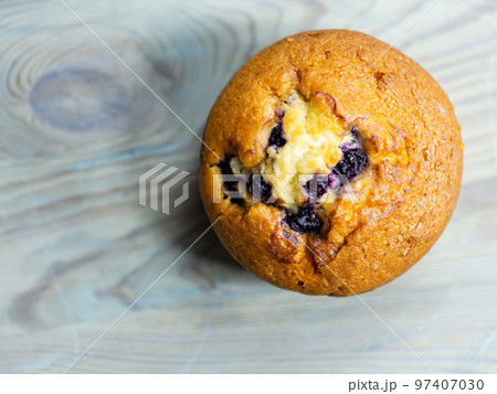Blueberry muffin on rustic wooden background Blueberry muffin on rustic wooden background 97407030