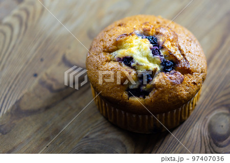 Blueberry muffin on rustic wooden background Blueberry muffin on rustic wooden background 97407036