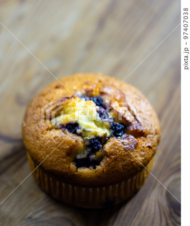 Blueberry muffin on rustic wooden background Blueberry muffin on rustic wooden background 97407038