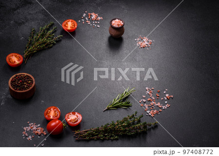 Fresh raw pork meat on the ribs with spices and herbs on a wooden cutting board 97408772