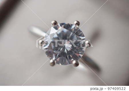Diamond ring in jewelry gift box close up background 97409522