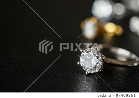 Jewelry diamond rings set on black background close up Jewelry diamond rings set on black background close up 97409561